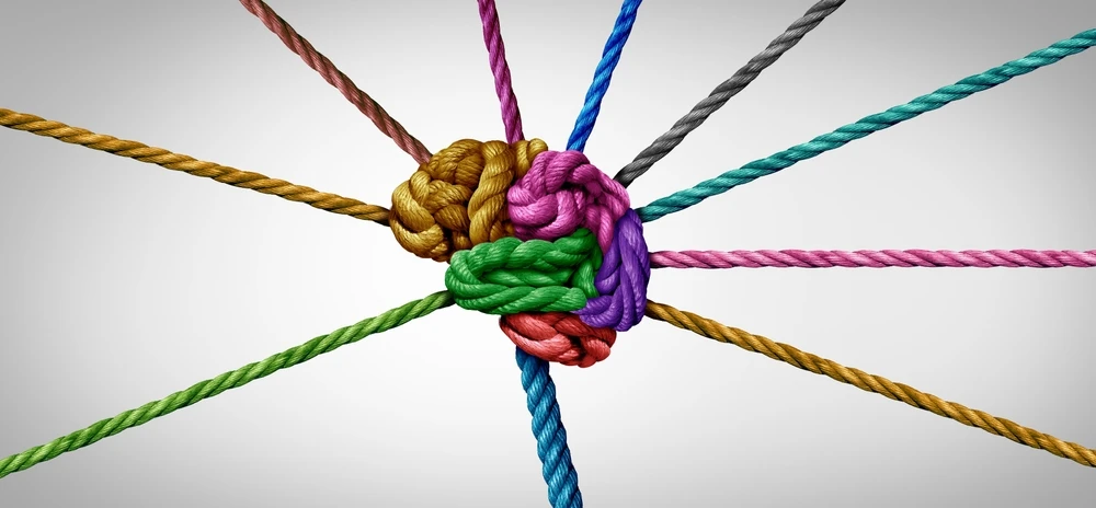 Kleurige touwen knopen samen, symboliserend ADHD en verslaving als complexe verbindingen.