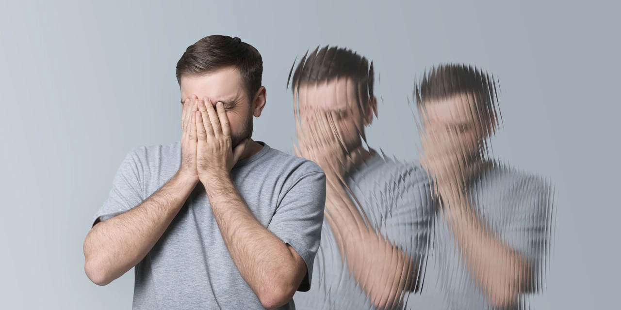 Man met handen voor gezicht en wazige dubbelbeelden door lachgasverslaving.